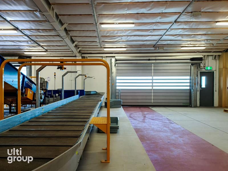 Ulti Spiral Door installed in an airport baggage handling facility.